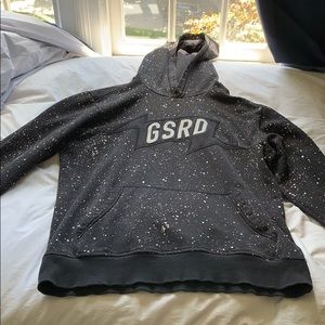 Black sweatshirt with white paint splatter